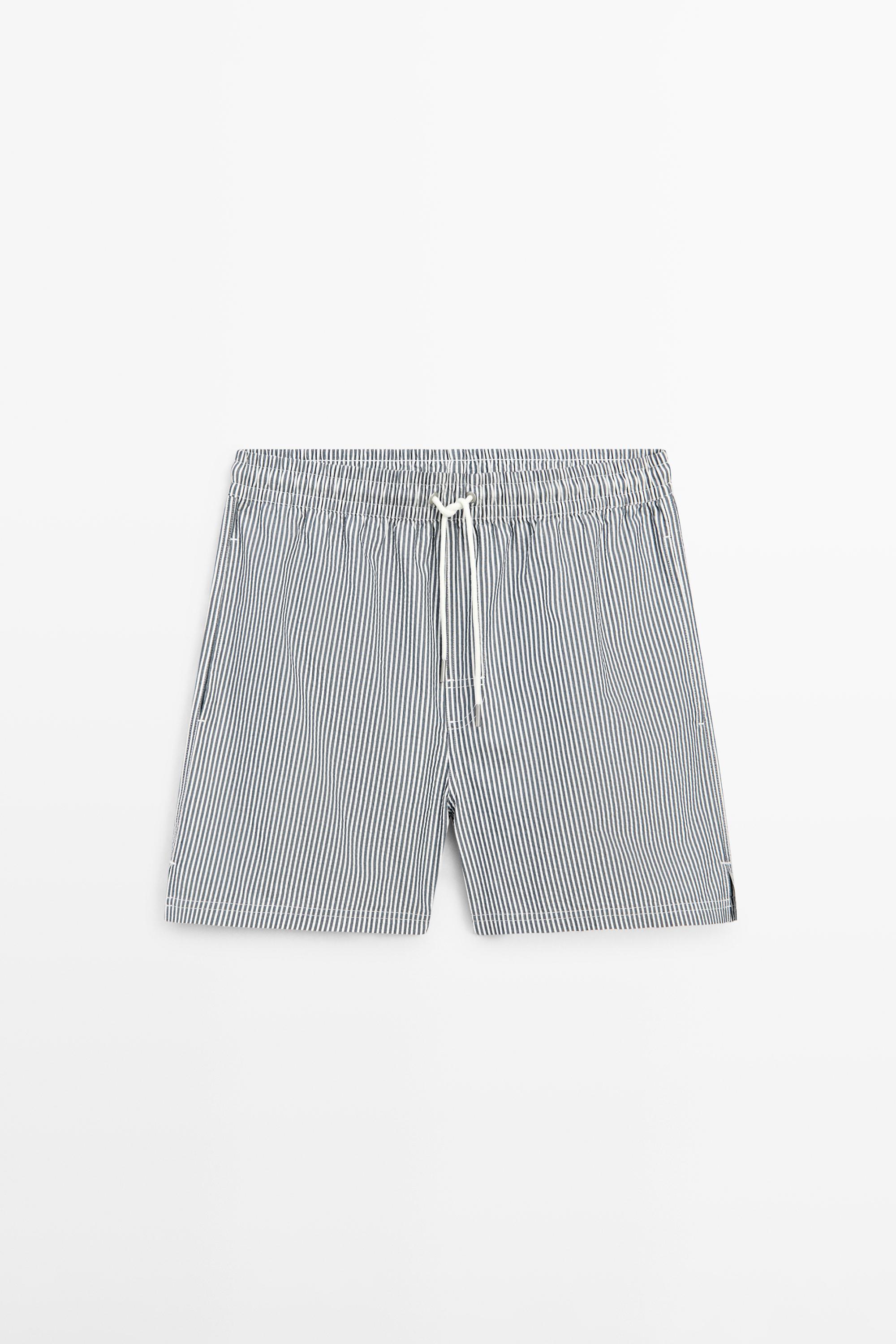 Swimming trunks with striped details